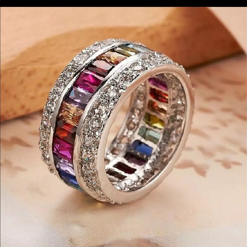 One Love thumb ring: Multicolored infinity band with white zirconia bagu…